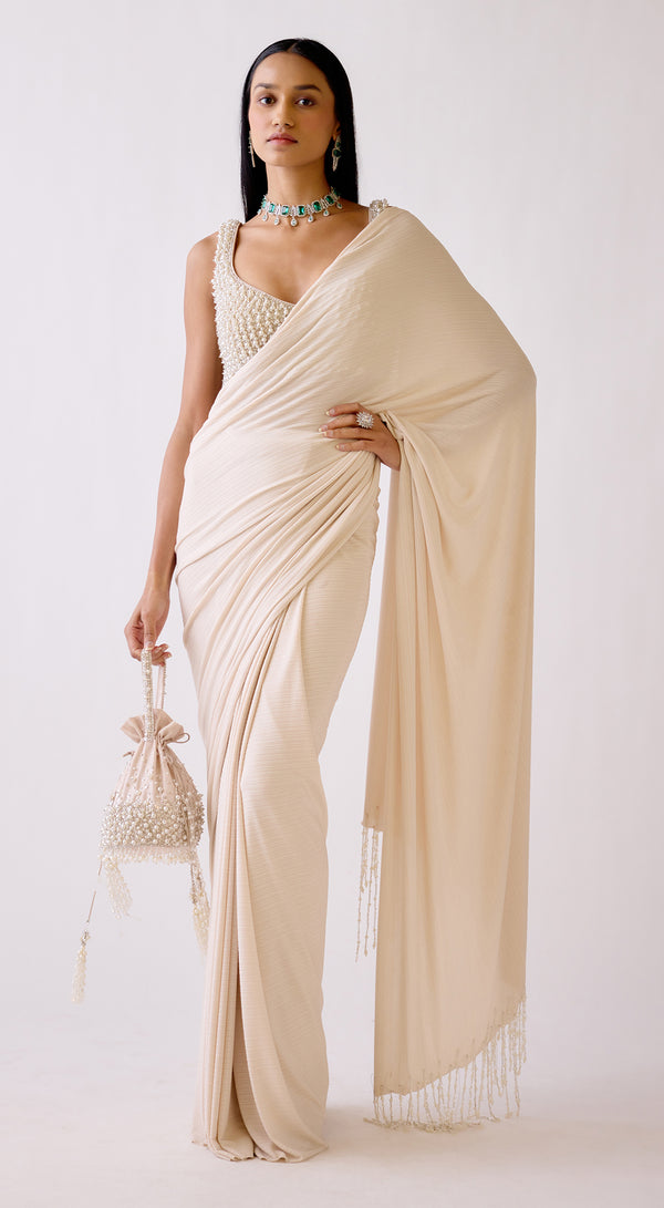 Gold pearl work draped saree by Basanti Kapde Aur Koffee for festive occasions