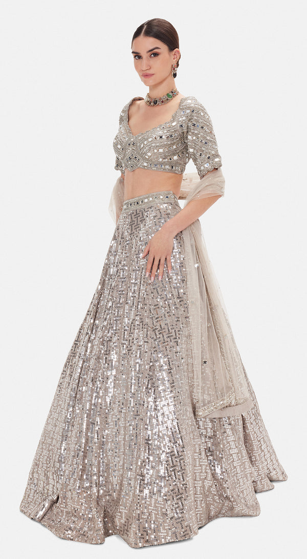Basanti Kapde Aur Koffee The Silver Odyssey grey lehenga with detailed festive embellishments