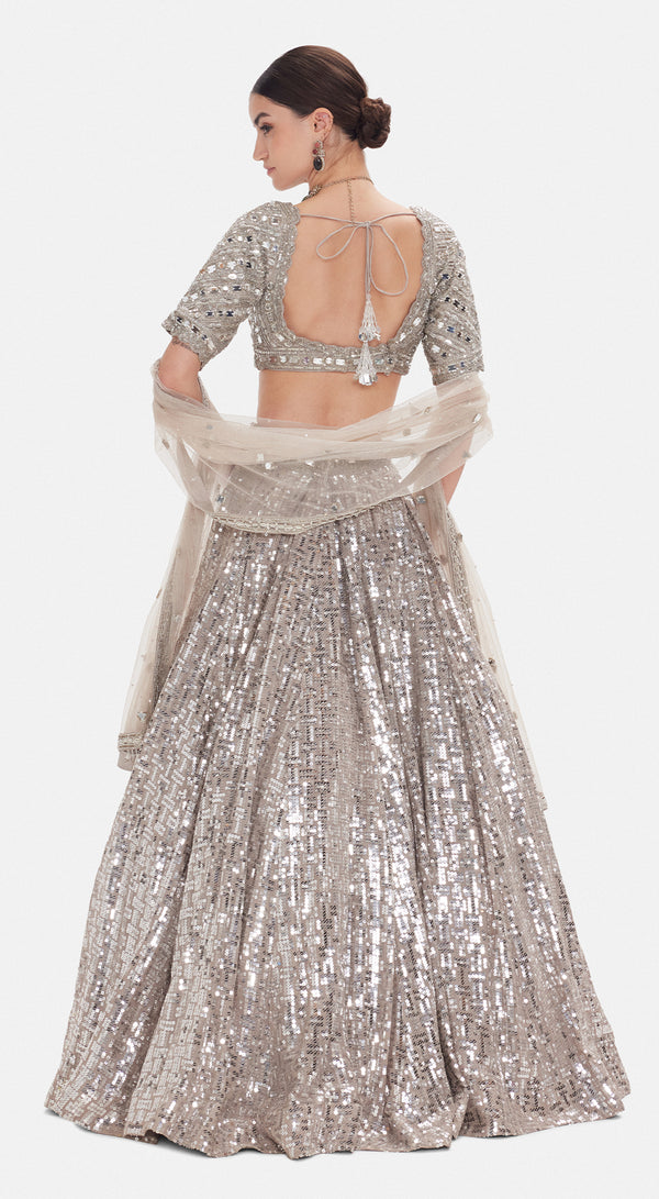 Basanti Kapde Aur Koffee The Silver Odyssey grey lehenga with detailed festive embellishments