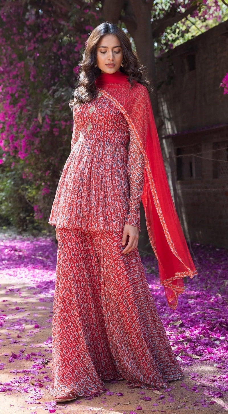 Drop Printed Full Sleeves Sharara Suit Set with A Peplum Top Front Embellishment - RED - Basanti Kapde aur Koffee